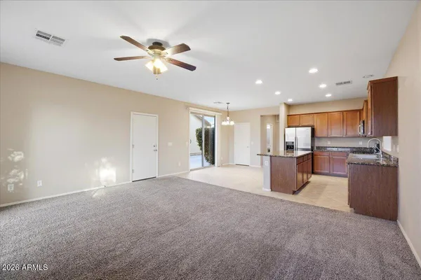 a view of a kitchen with a sink and a window