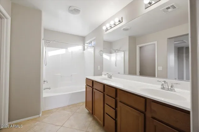 a view of a yard with a house in the background