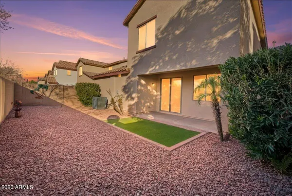 a view of a backyard of the house