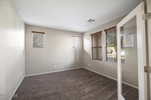 a view of empty room with windows