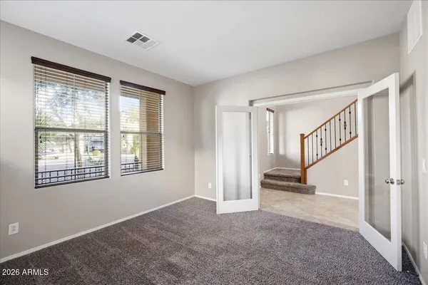 a view of an empty room with a window