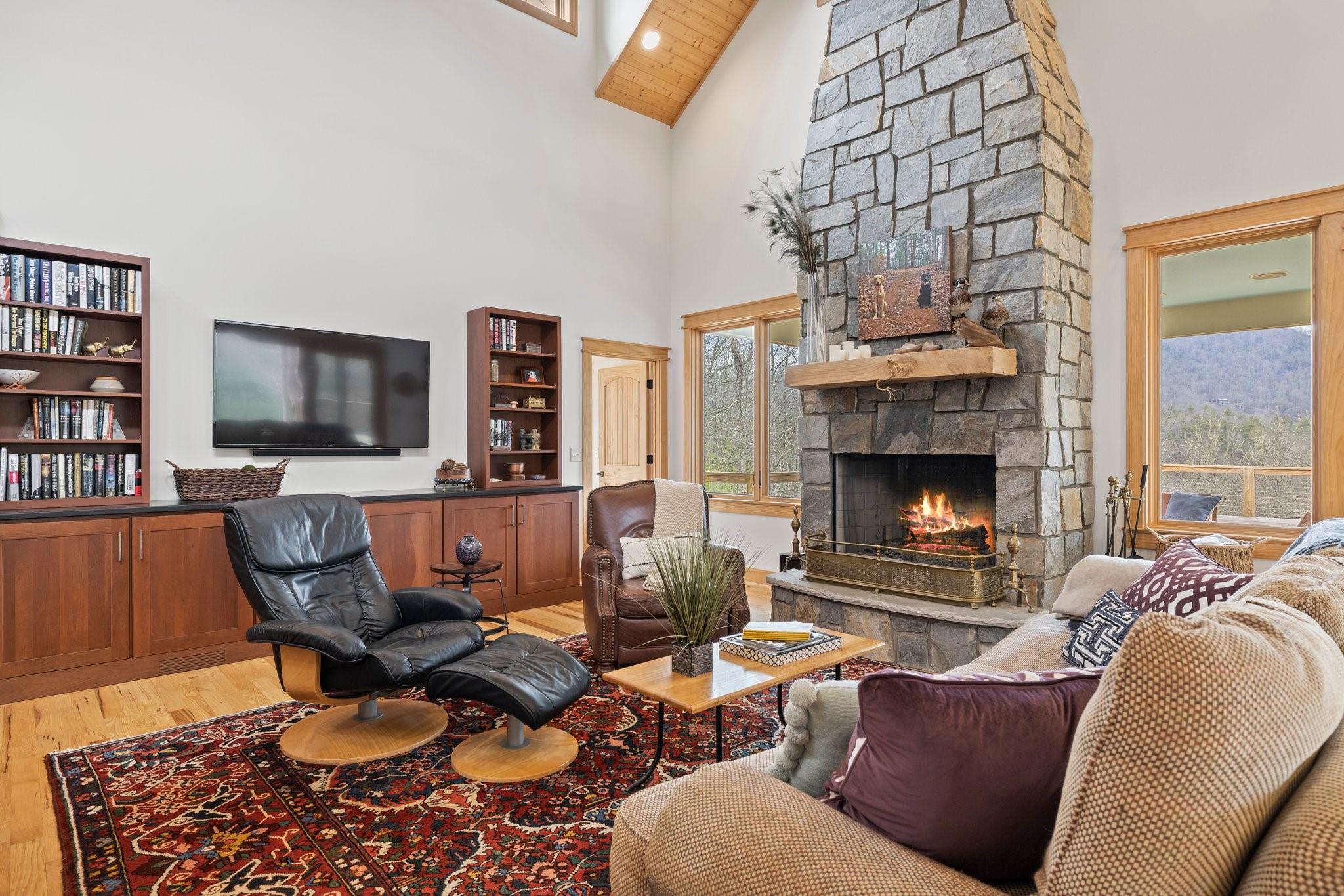 41 Rowan Hl Road Leicester, NC 28748 - Photo 11 of 48 a living room with furniture a coffee table and a fireplace