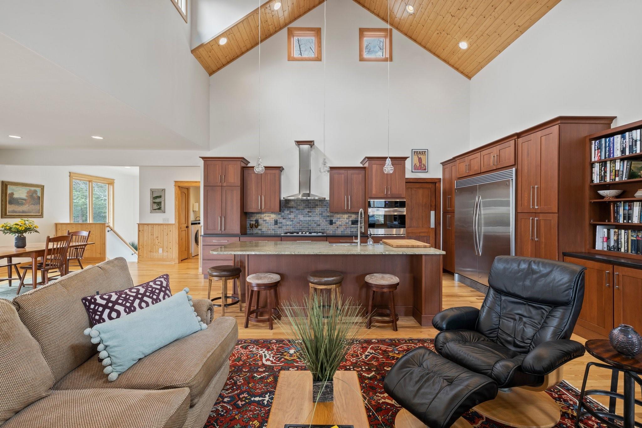 41 Rowan Hl Road Leicester, NC 28748 - Photo 14 of 48 a living room with furniture a rug and a chandelier