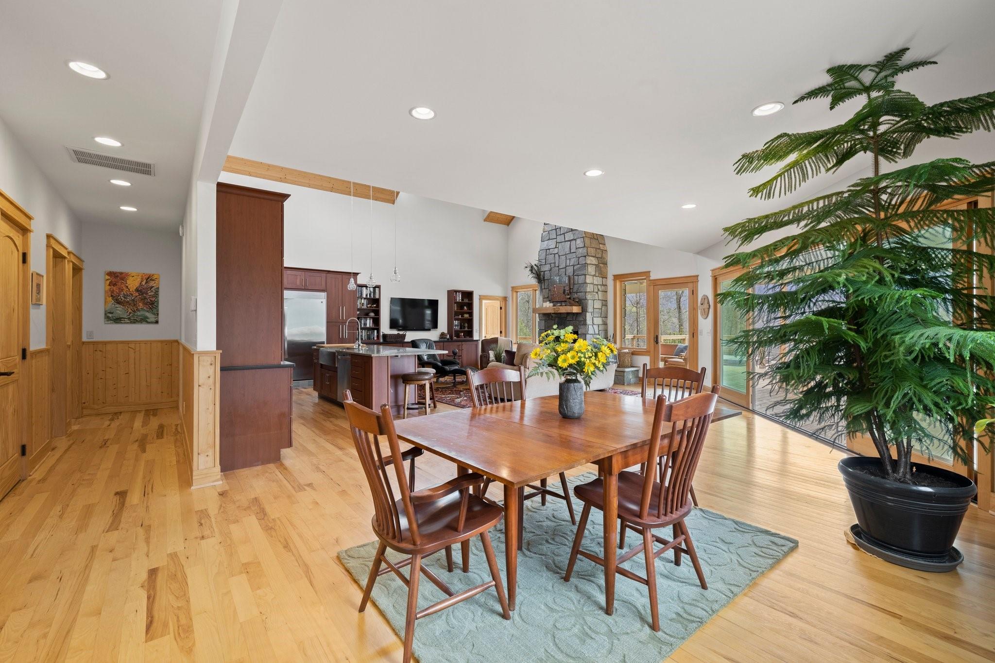 41 Rowan Hl Road Leicester, NC 28748 - Photo 16 of 48 a dining room with furniture and wooden floor
