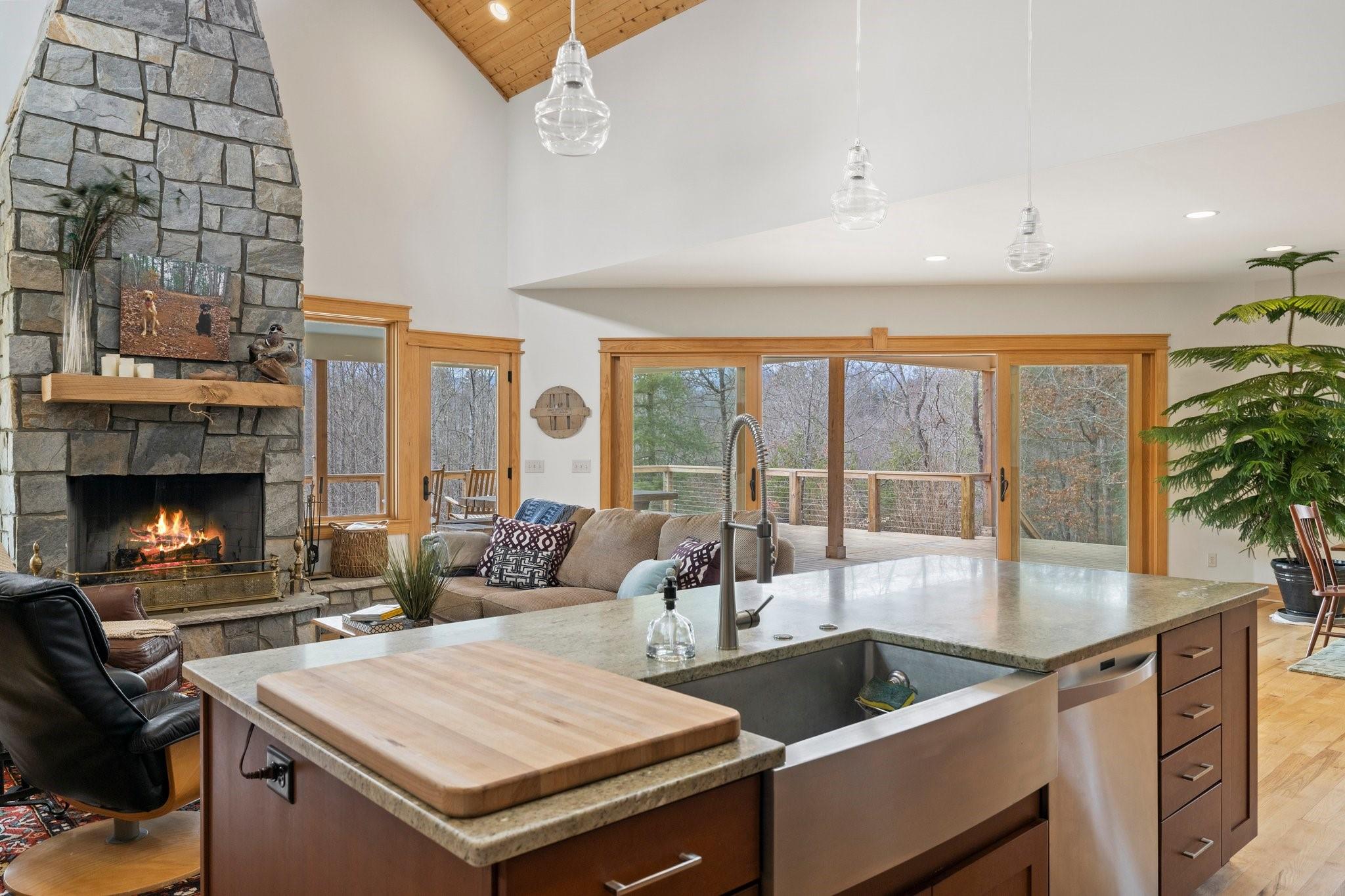 41 Rowan Hl Road Leicester, NC 28748 - Photo 18 of 48 a kitchen with a stove a sink and a wooden cabinets