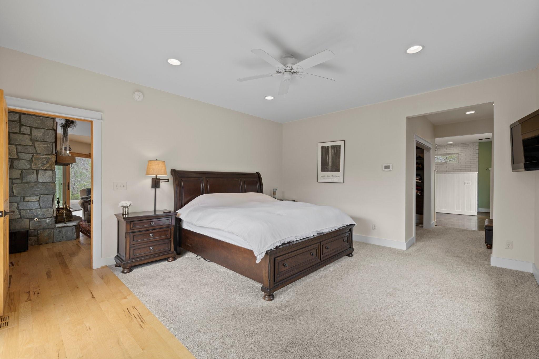 41 Rowan Hl Road Leicester, NC 28748 - Photo 22 of 48 a spacious bedroom with a bed and cabinet