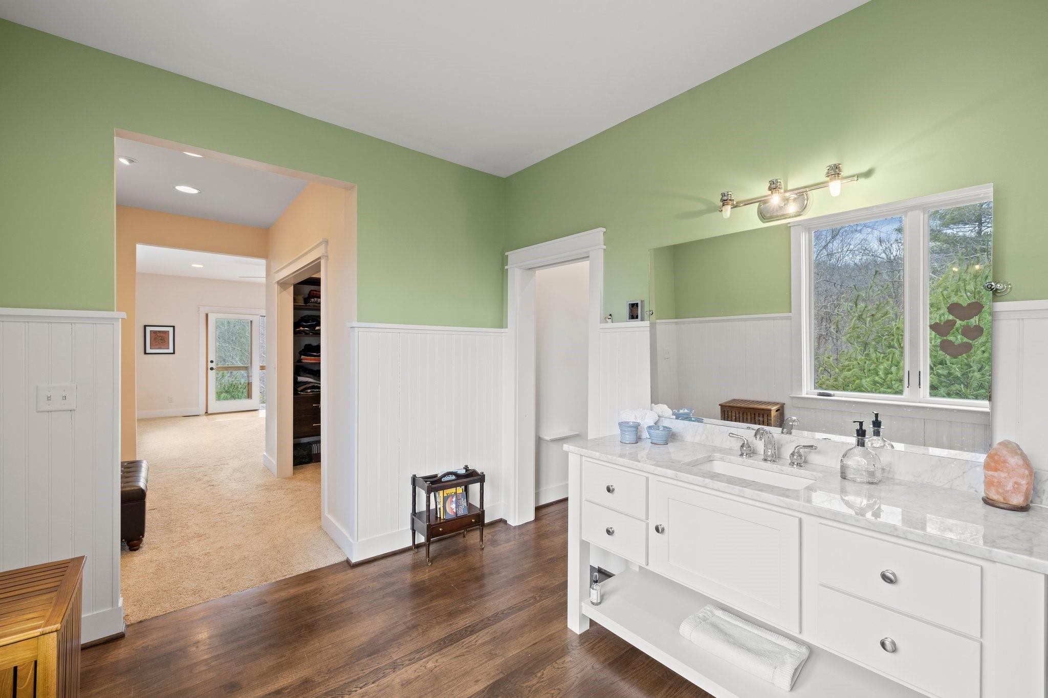 41 Rowan Hl Road Leicester, NC 28748 - Photo 25 of 48 a spacious bathroom with a double vanity sink a mirror and shower