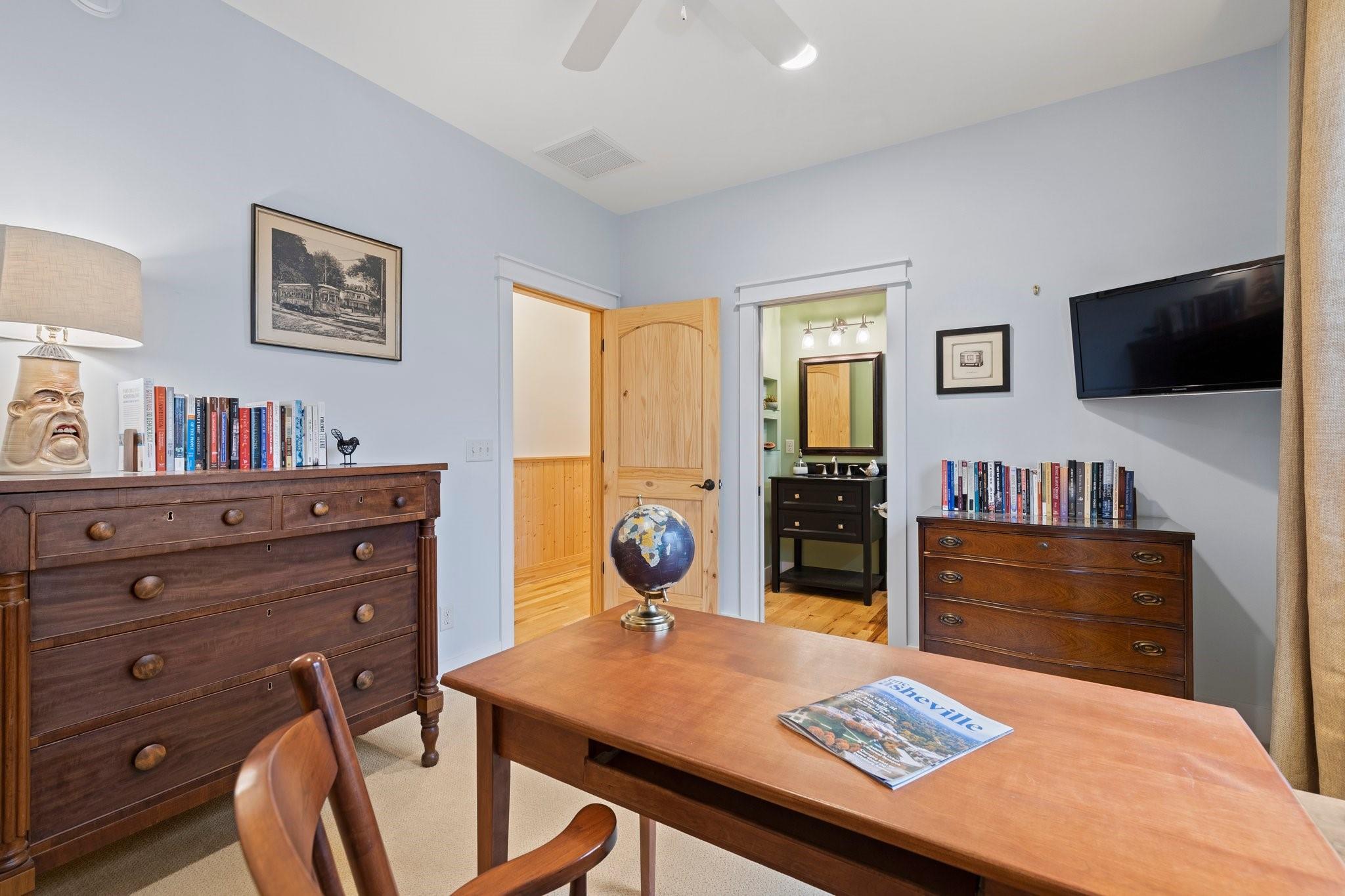 41 Rowan Hl Road Leicester, NC 28748 - Photo 26 of 48 a living room with furniture flat screen tv and kitchen view