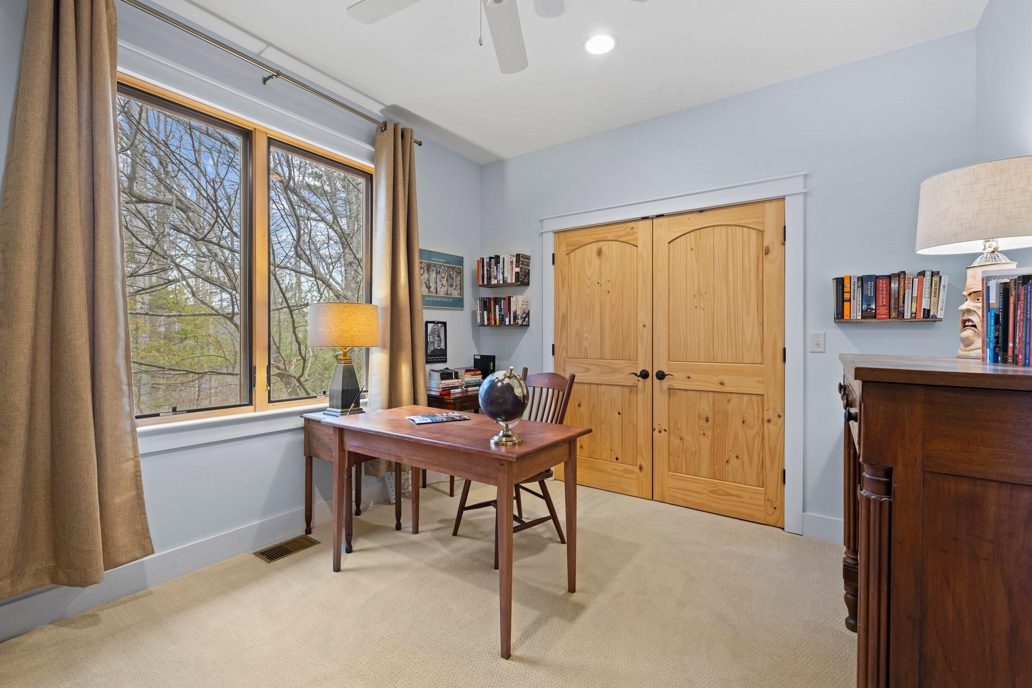 41 Rowan Hl Road Leicester, NC 28748 - Photo 27 of 48 a view of a workspace with furniture and a window