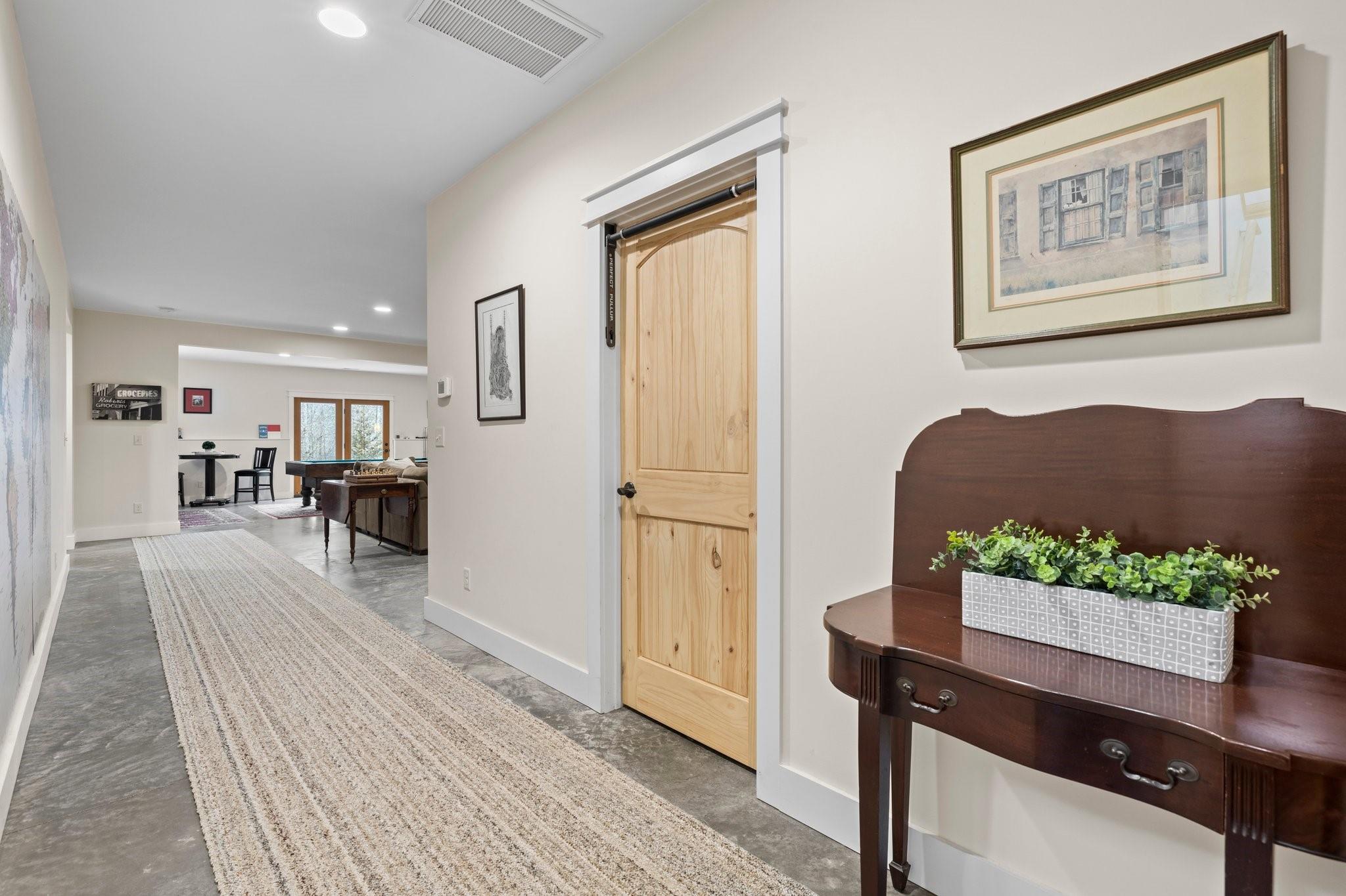 41 Rowan Hl Road Leicester, NC 28748 - Photo 30 of 48 a living room with furniture wooden floor and a table