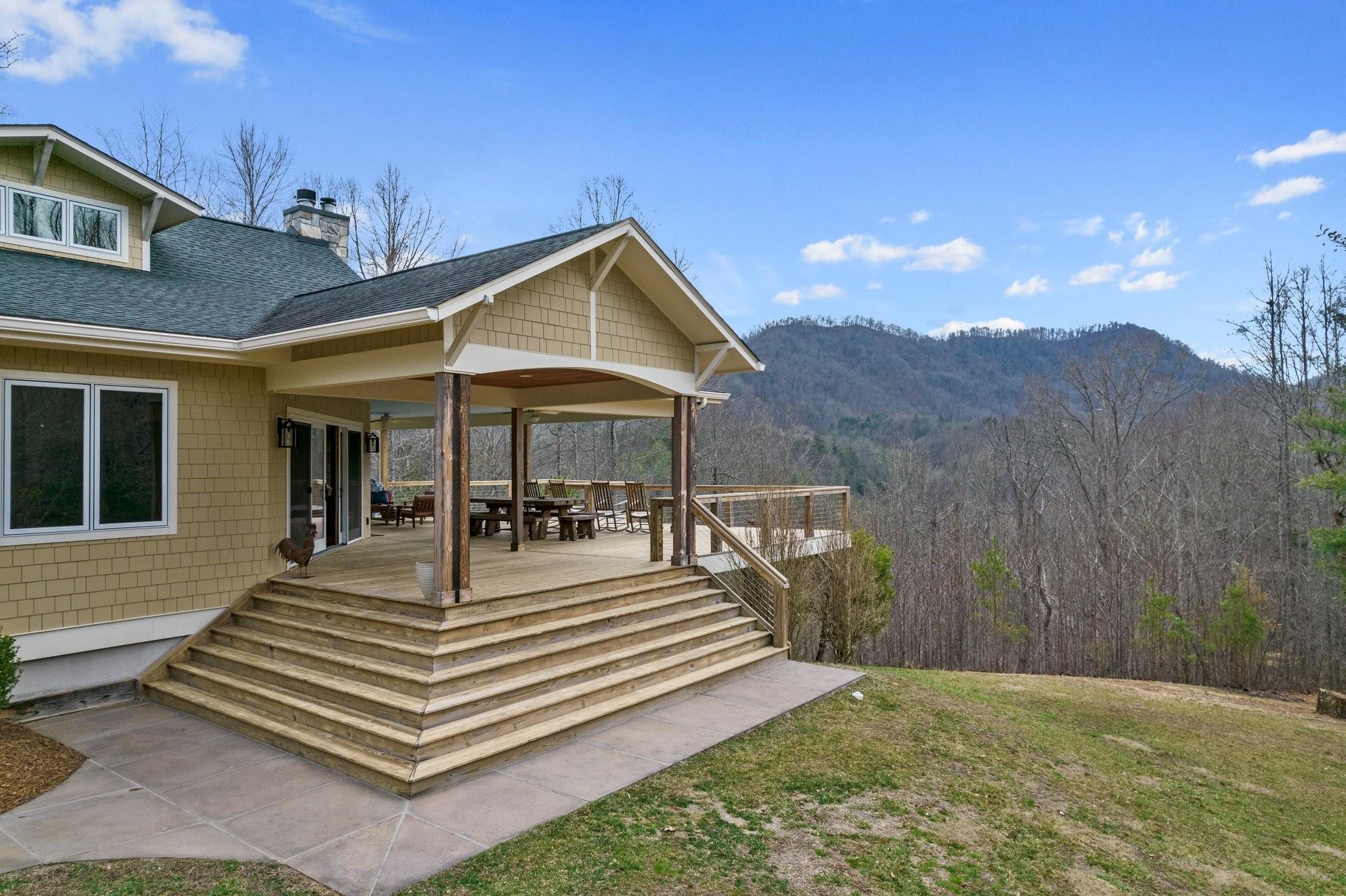 41 Rowan Hl Road Leicester, NC 28748 - Photo 3 of 48 a view of a dinning table and chairs in patio of the house