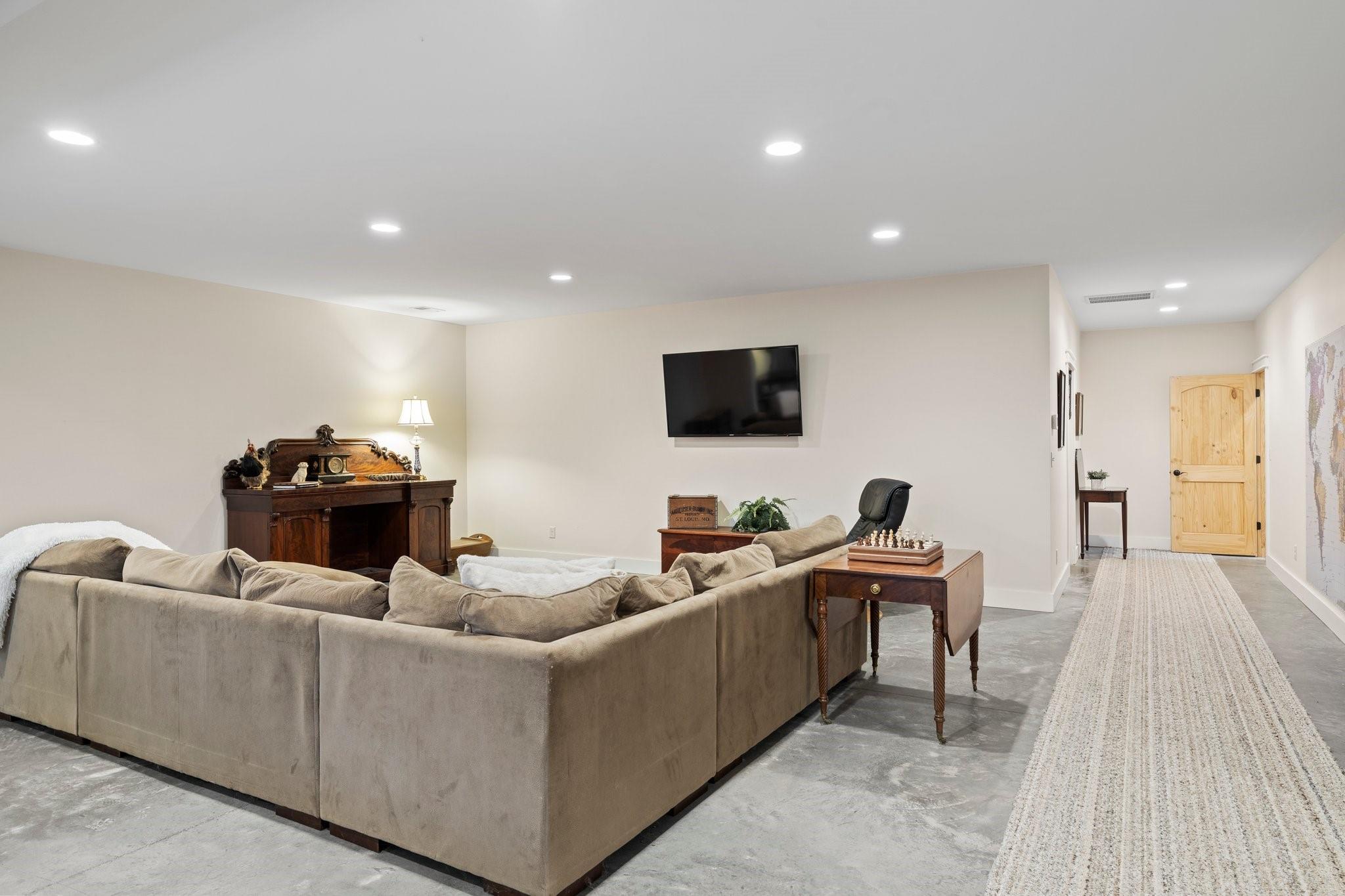 41 Rowan Hl Road Leicester, NC 28748 - Photo 31 of 48 a living room with furniture and a flat screen tv