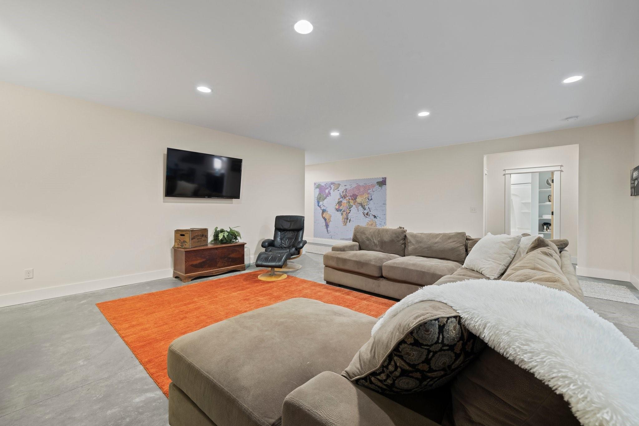 41 Rowan Hl Road Leicester, NC 28748 - Photo 32 of 48 a living room with furniture and a flat screen tv