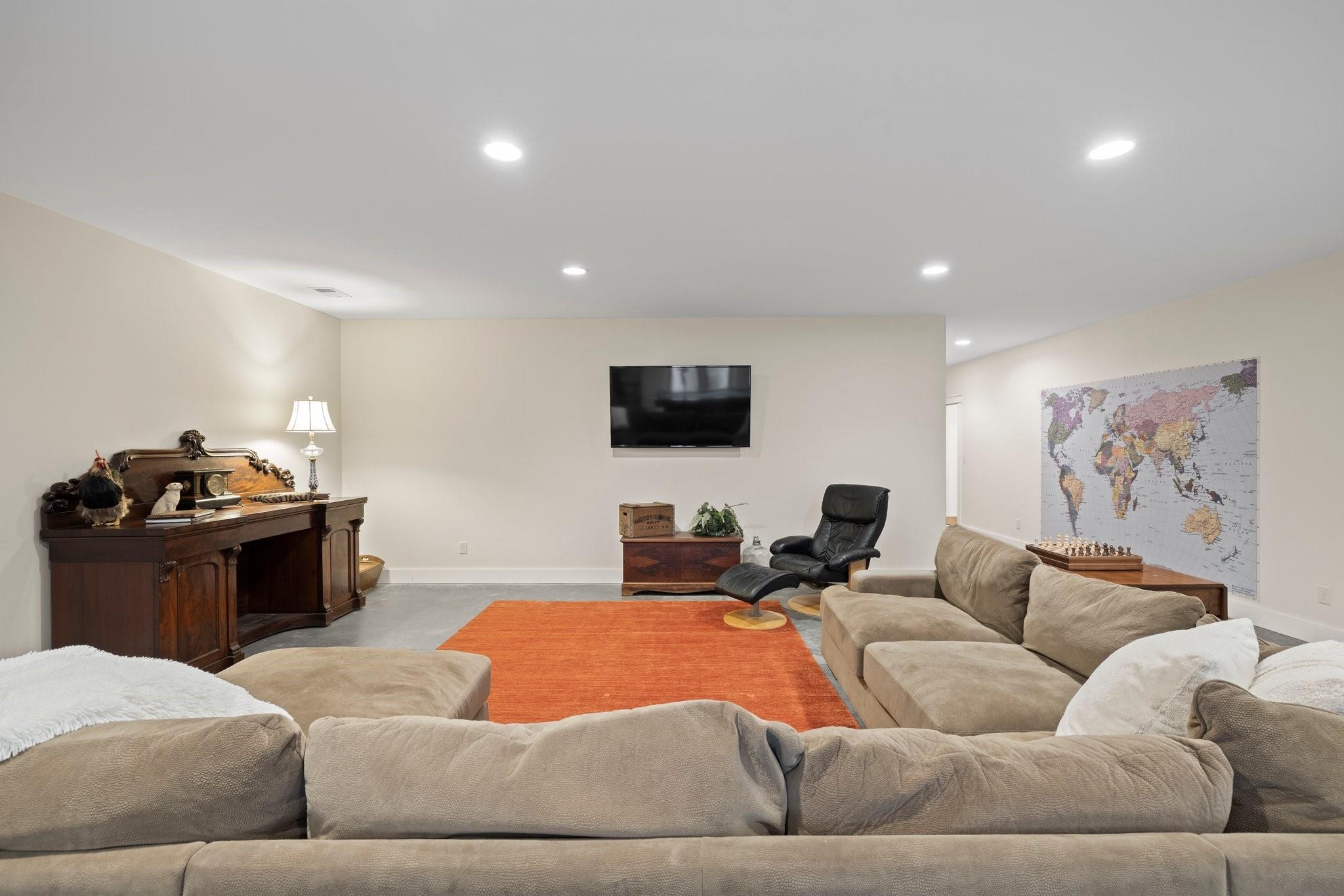 41 Rowan Hl Road Leicester, NC 28748 - Photo 33 of 48 a living room with furniture and a flat screen tv