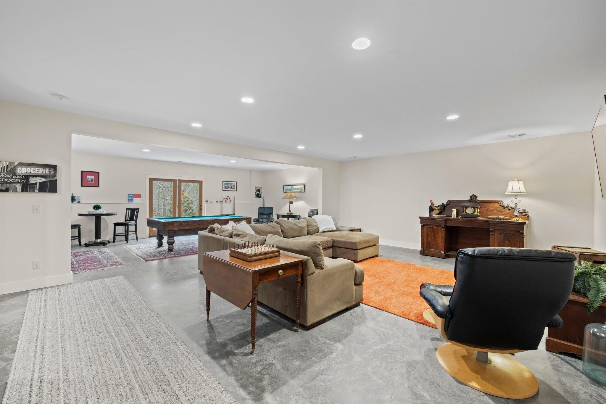 41 Rowan Hl Road Leicester, NC 28748 - Photo 35 of 48 a living room with furniture and a wooden floor