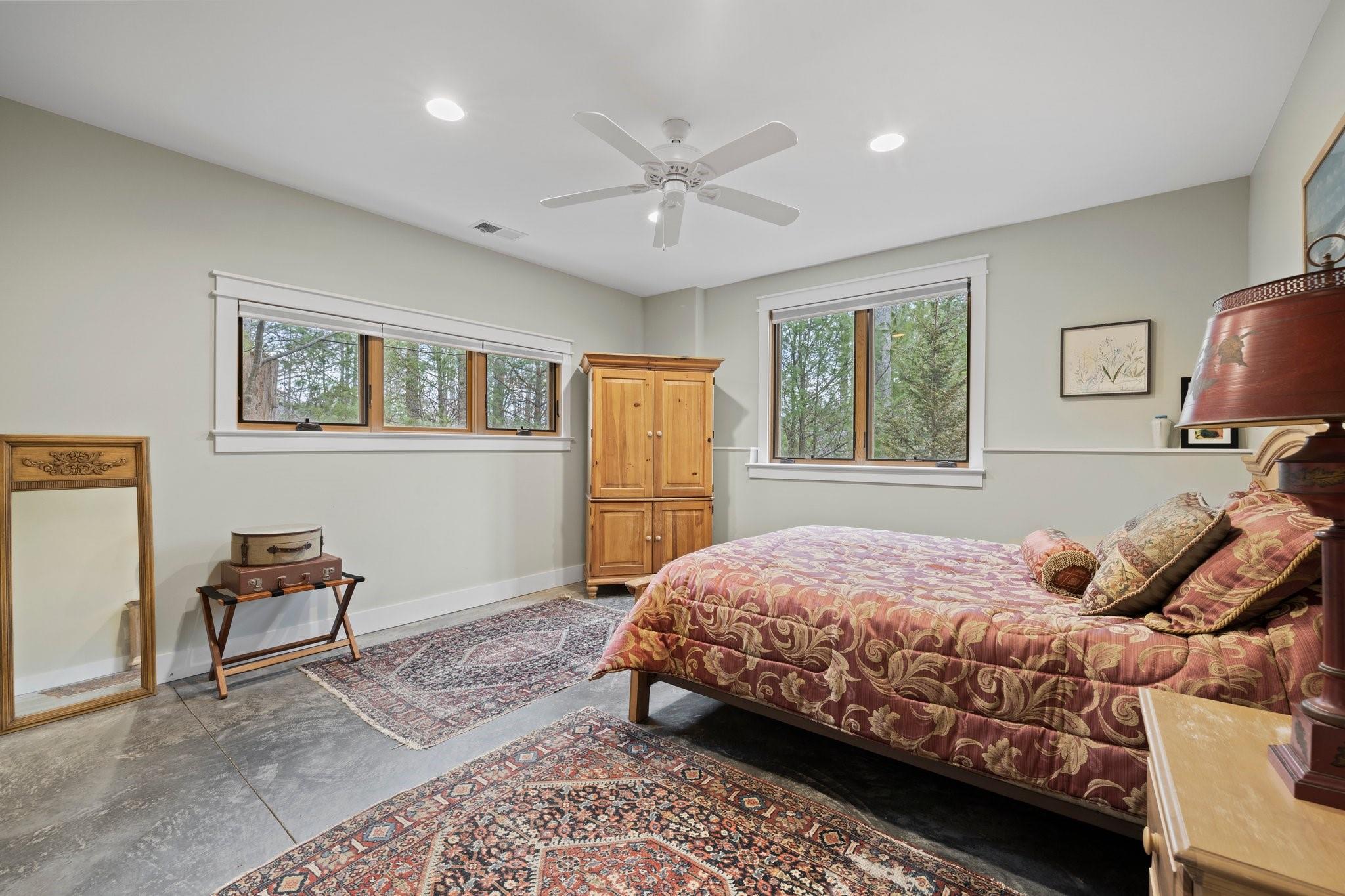 41 Rowan Hl Road Leicester, NC 28748 - Photo 38 of 48 a bedroom with a bed and a chandelier