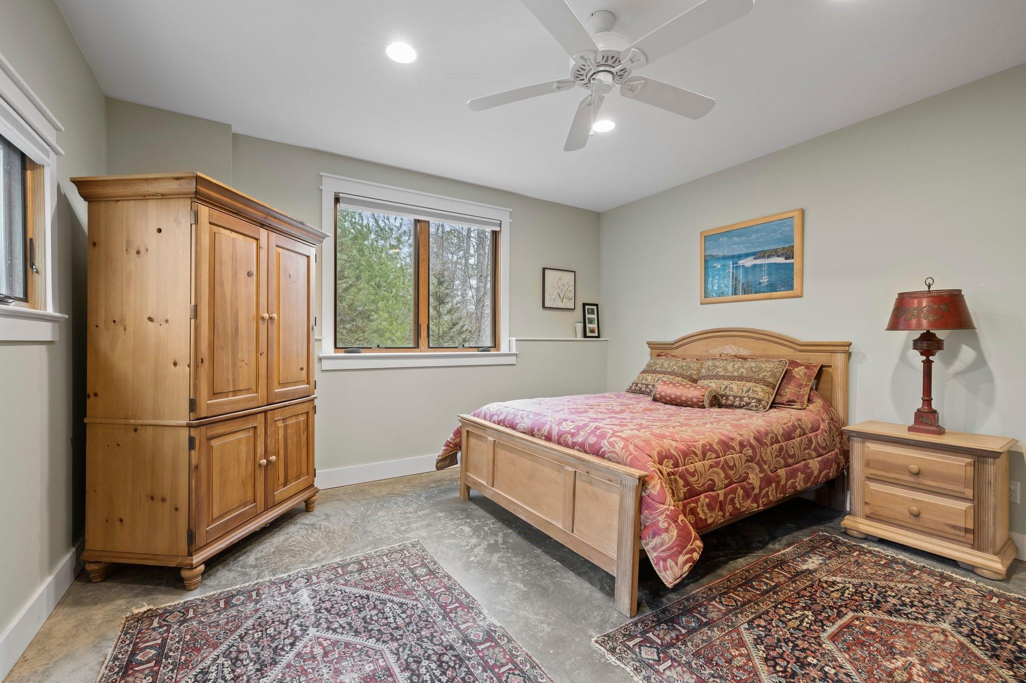 41 Rowan Hl Road Leicester, NC 28748 - Photo 39 of 48 a bedroom with a large bed and a window