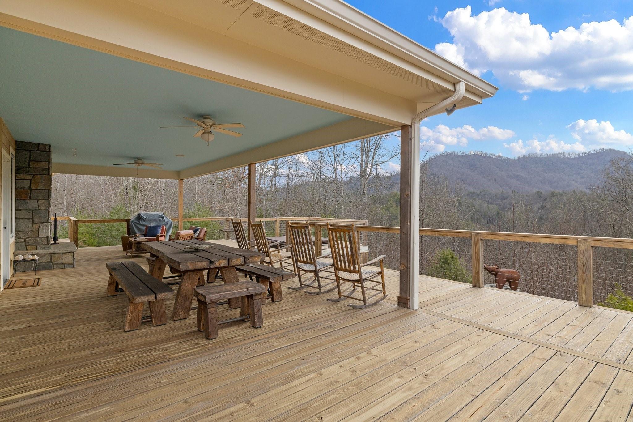41 Rowan Hl Road Leicester, NC 28748 - Photo 5 of 48 a view of a terrace with furniture and outside view