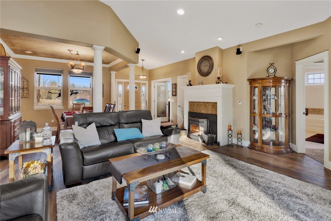1107 Slater Road Bellingham, WA 98226 - Photo 13 of 39 a living room with furniture wooden floor and a fireplace