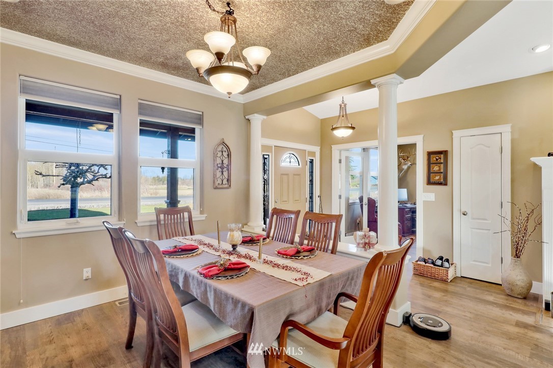 1107 Slater Road Bellingham, WA 98226 - Photo 16 of 39 a view of a dining room with furniture and chandelier