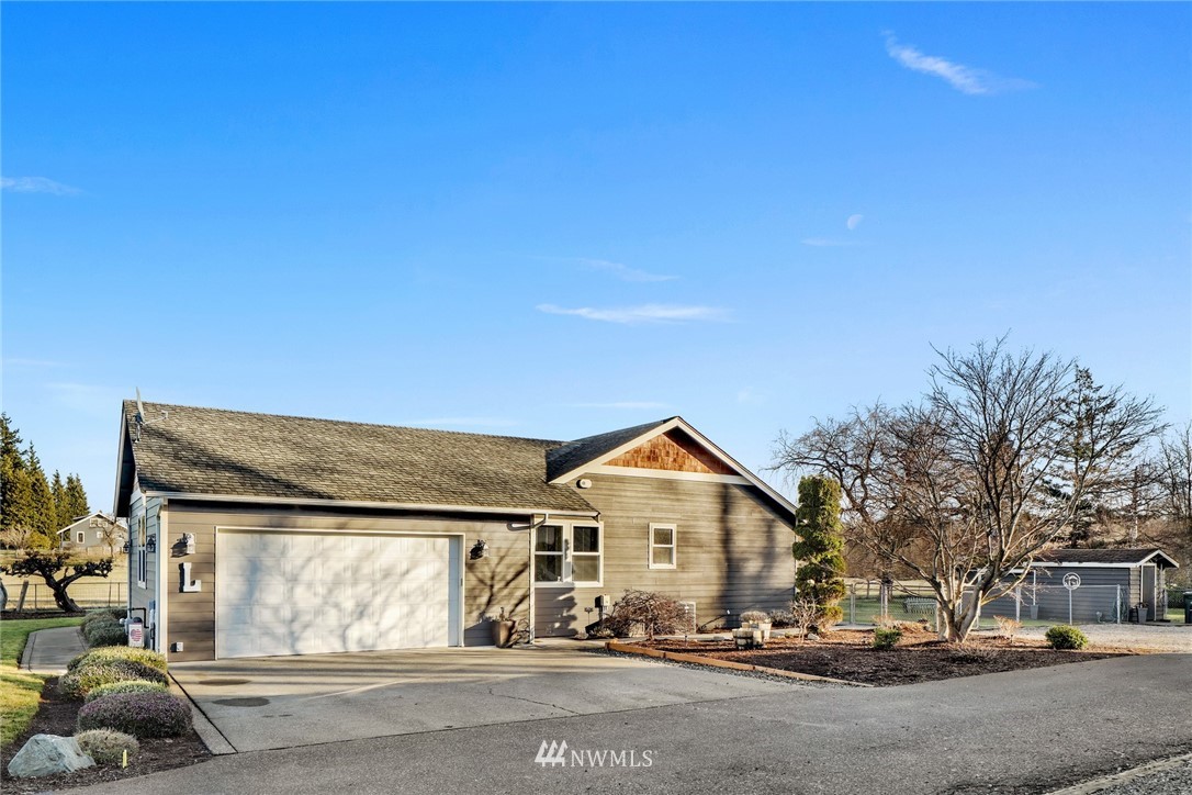 1107 Slater Road Bellingham, WA 98226 - Photo 2 of 39 a front view of a house with a yard