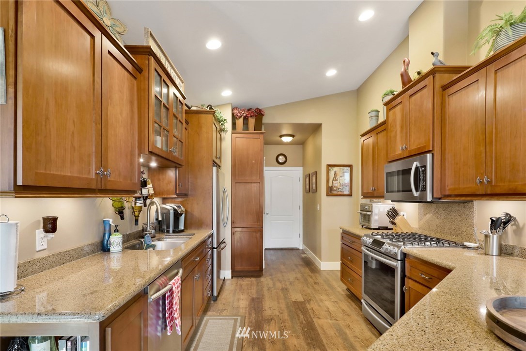 1107 Slater Road Bellingham, WA 98226 - Photo 21 of 39 a kitchen with stainless steel appliances granite countertop a sink stove and refrigerator