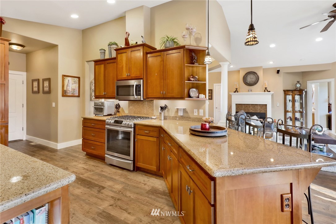1107 Slater Road Bellingham, WA 98226 - Photo 22 of 39 a kitchen with stainless steel appliances granite countertop a sink a stove and a refrigerator