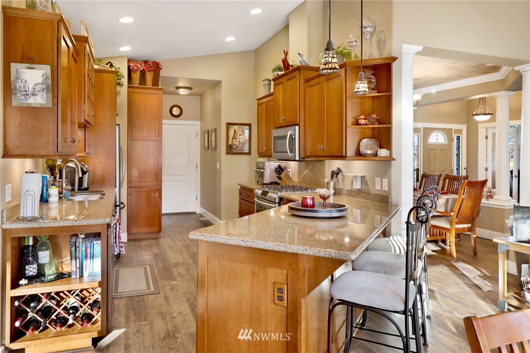 1107 Slater Road Bellingham, WA 98226 - Photo 26 of 39 a kitchen with a refrigerator and a sink