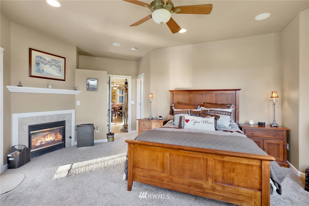 1107 Slater Road Bellingham, WA 98226 - Photo 33 of 39 a bedroom with a bed and a fireplace