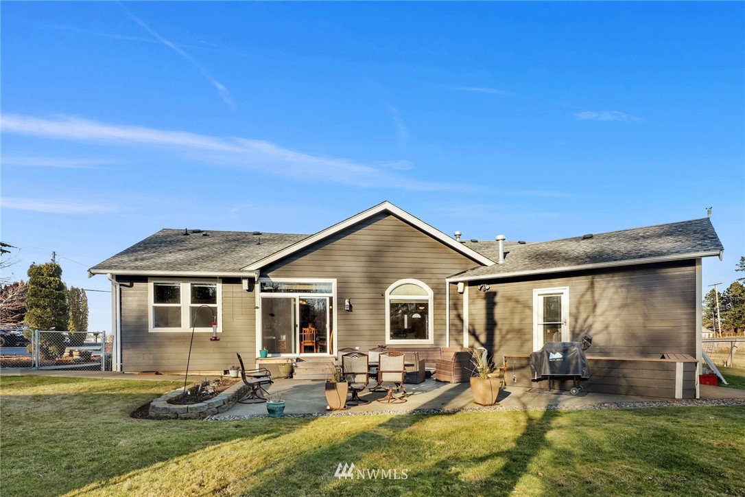 1107 Slater Road Bellingham, WA 98226 - Photo 35 of 39 a view of a house with backyard sitting area and garden