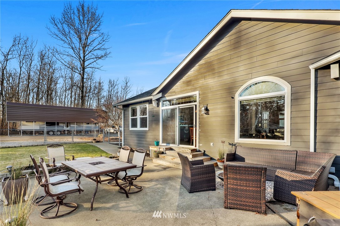 1107 Slater Road Bellingham, WA 98226 - Photo 37 of 39 a view of a house with swimming pool and sitting area