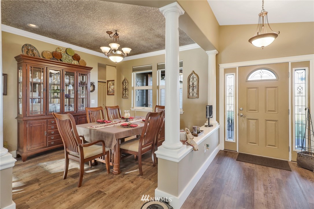 1107 Slater Road Bellingham, WA 98226 - Photo 10 of 39 a view of a dining room with furniture window and wooden floor