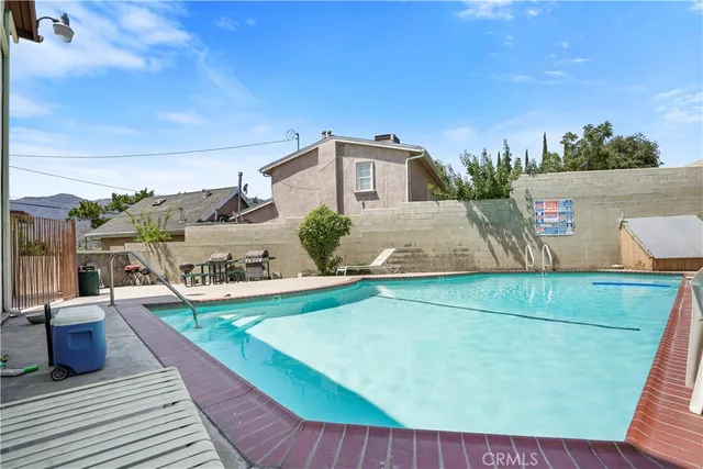 a view of a backyard with a sitting area