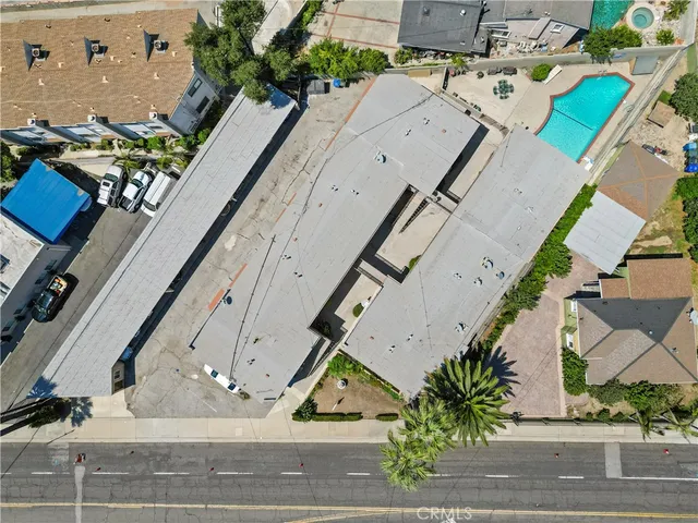 an aerial view of residential houses with outdoor space