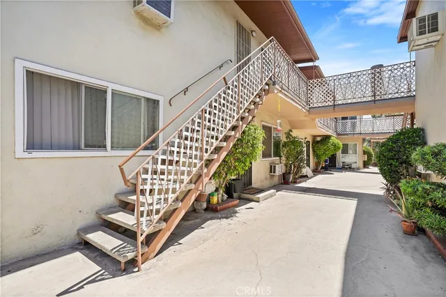a front view of a house with parking area