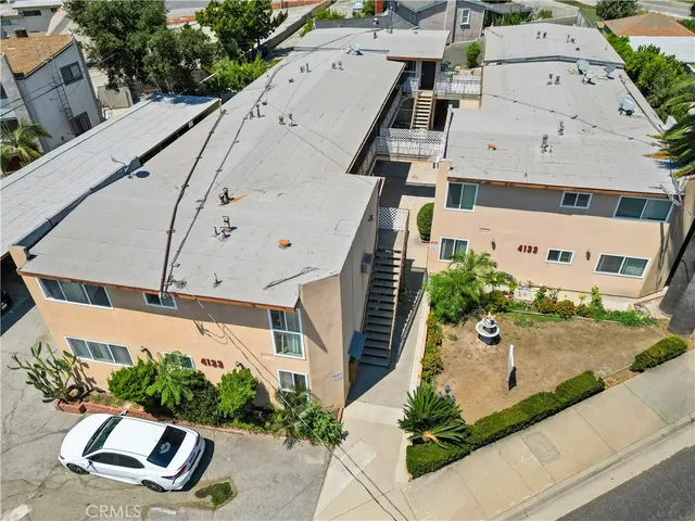 a view of a terrace with a garden and mountain view
