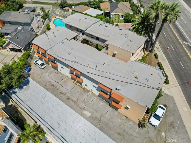 a view of a swimming pool with potted plants