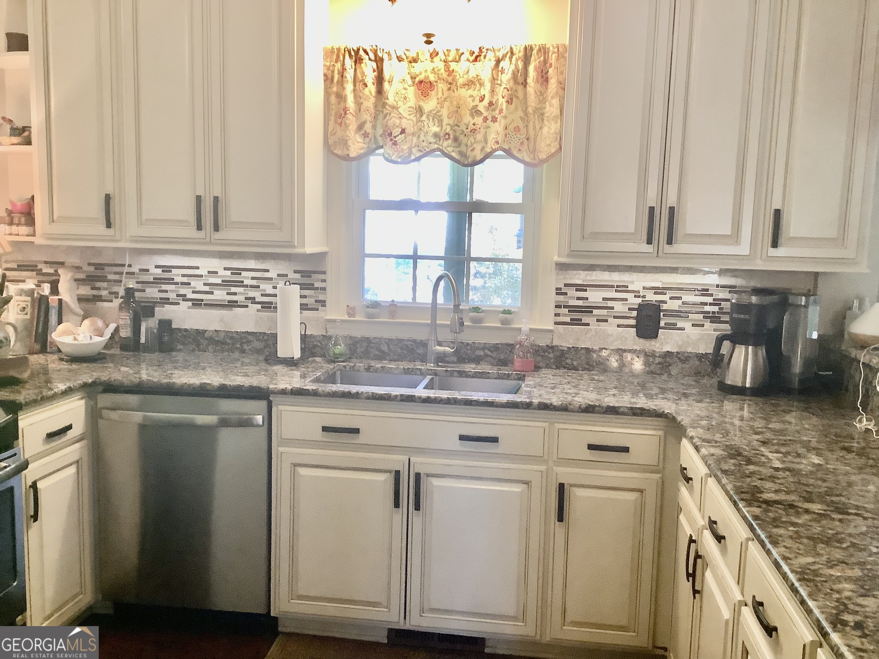 108 Deerbrook Drive Rome, GA 30165 - Photo 13 of 40 a kitchen with granite countertop white cabinets and a window