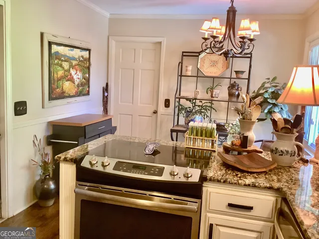 a kitchen with a stove and cabinets