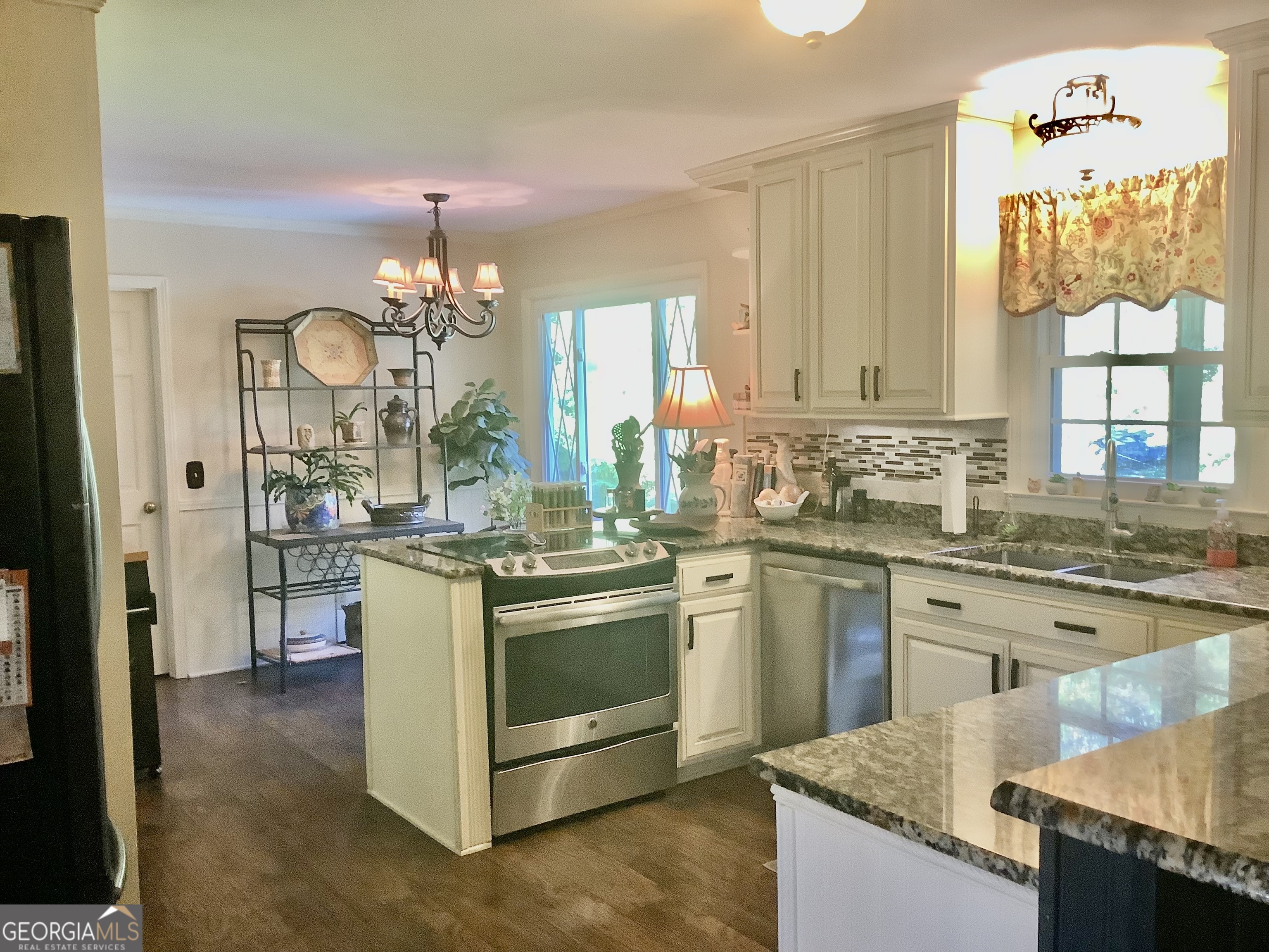 108 Deerbrook Drive Rome, GA 30165 - Photo 16 of 40 a kitchen with stainless steel appliances granite countertop a stove oven and a refrigerator