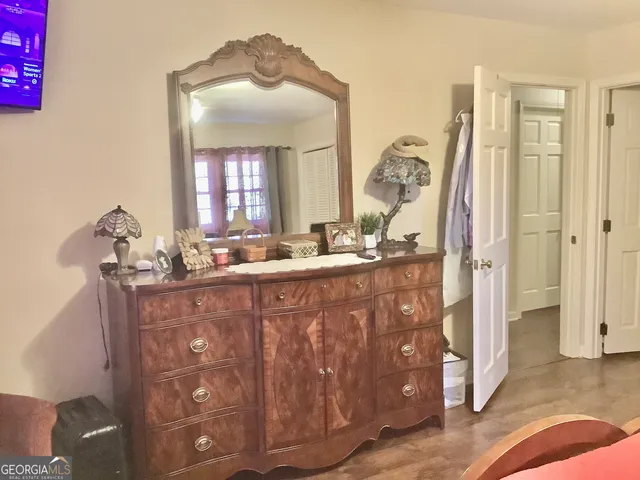 a bathroom with a sink vanity and mirror