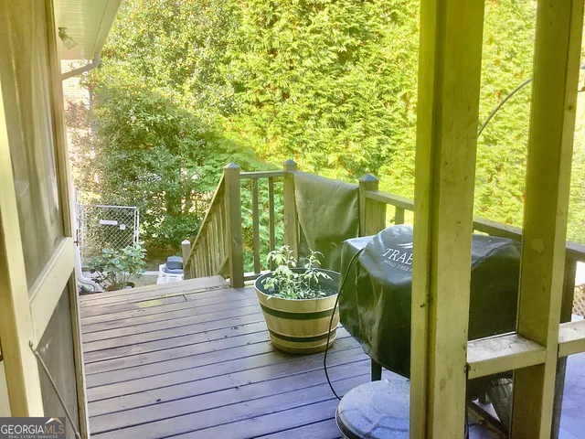 a view of a balcony with chair and table