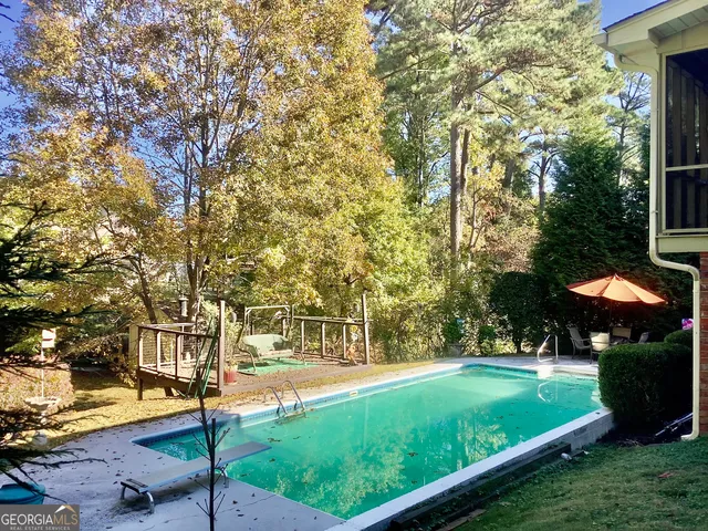a view of a park with large trees