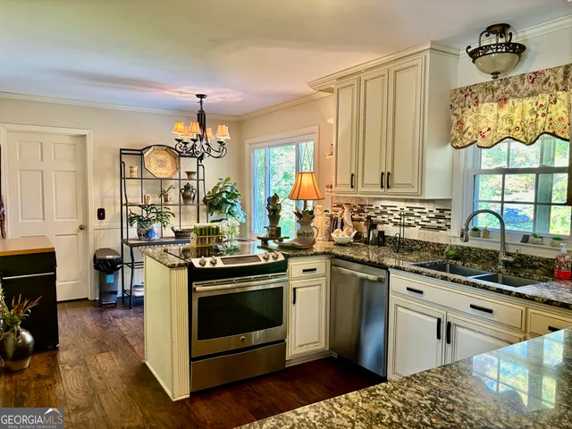 a kitchen with a stove and a sink