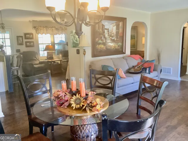 a dining room with furniture and window
