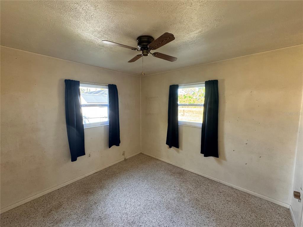 1405 Ingram Avenue Sarasota, FL 34232 - Photo 11 of 15 a view of a livingroom with a ceiling fan and window