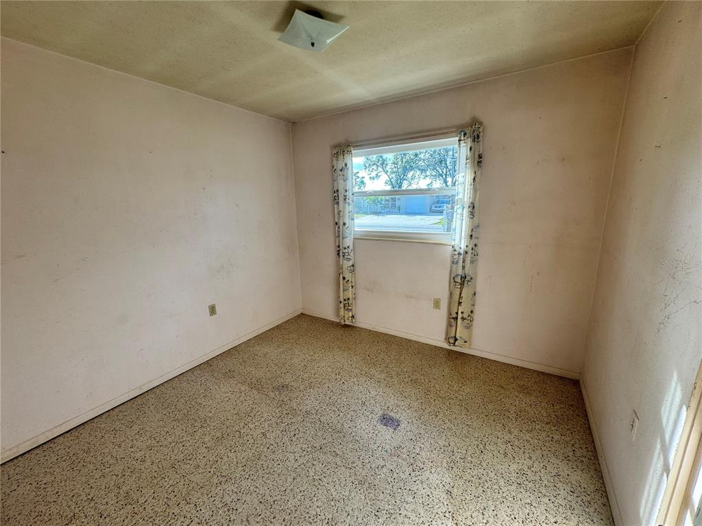1405 Ingram Avenue Sarasota, FL 34232 - Photo 12 of 15 an empty room with windows