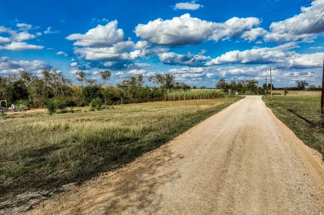 a view of a swimming pool and an outdoor space