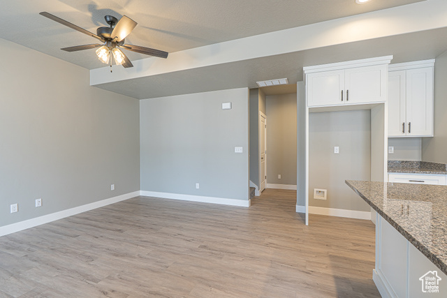2242 South 1120 West, Unit 69 Logan, UT 84321 - Photo 10 of 26 Unfurnished living room with light wood-style flooring and a ceiling fan