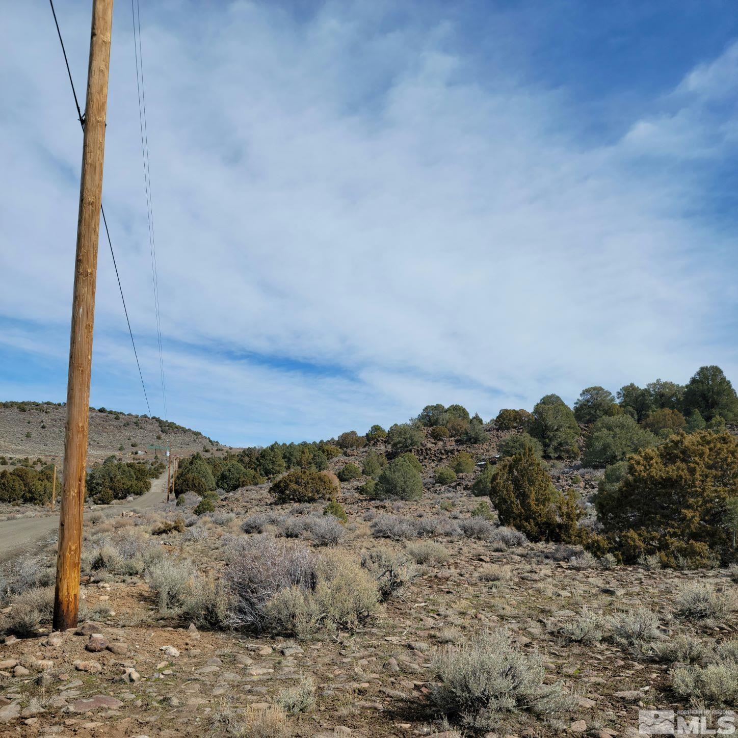 3420 Cartwright Road, Unit 342 Reno, NV 89521 - Photo 5 of 7 a view of a dry yard with mountains in the background